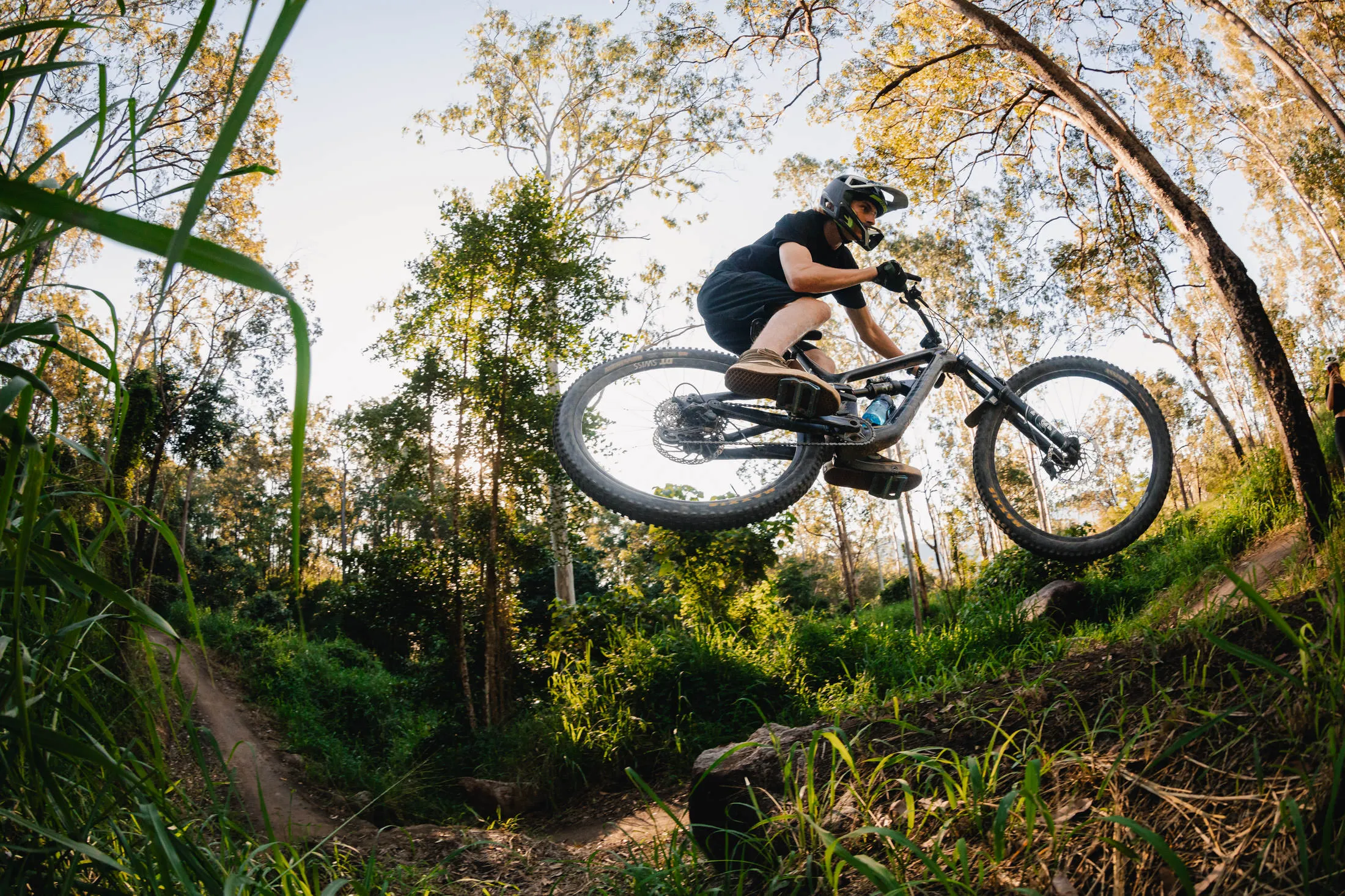 A rider getting air at Finch Hatton mountain bike trails
